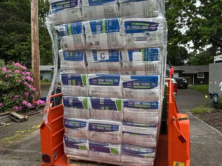 Stack of insulation materials for attic and crawl space encapsulation projects.